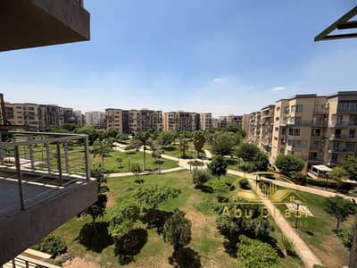 143 sqm apartment for sale in Madinaty – a rare find in B8, Group 83.  Features a stunning, direct, and unobstructed view of a wide garden.