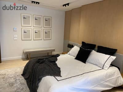 Apartment for sale, ready for immediate handover, finished to a "super deluxe" standard. The unit boasts a prime location, situated directly