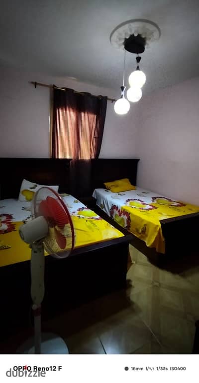 Furnished apartment for rent in Maadi, near the Olympic Club, the Maadi Library, and Nasr Street - Arab Maadi, consisting of three bedrooms, reception, bathroom, and kitchen, tenth floor, elevator, stunning view.