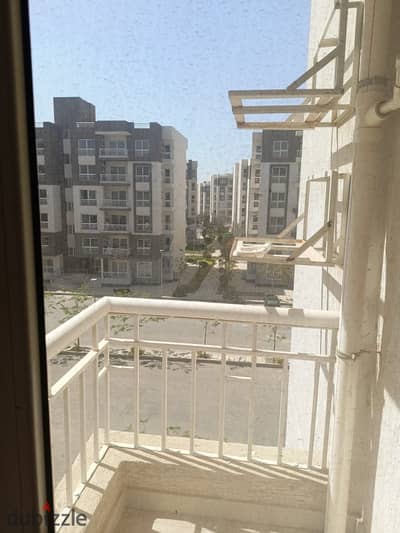 Apartment for sale in Madinaty B12  area 85 square meters 2 bedrooms and bathroom  total paid 1,700,000 EGP  required offer 1,600,000 EGP  remaining 5 annual installments, installment value 365,000 EGP  water, electricity, and gas meters total required 330000