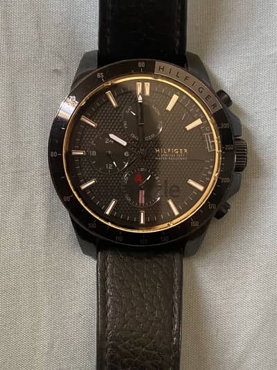 Tommy Hilfiger black watch used for sale ( needs a battery )