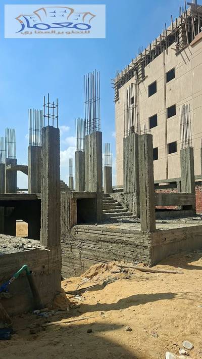 Land for sale at the best locations in Al-Tajamou, second row from the main street, with a basement and ground columns, with two apartments.