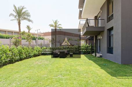 Modern furnished apartment with spacious private garden for sale in Cairo Festival City - AURA - New Cairo
