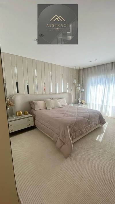 An apartment in a high-end compound featuring a beautiful view of greenerylocated in Taj City, New Cairo.