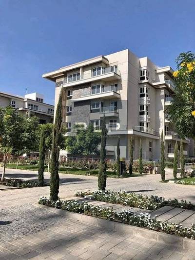 Ground-floor apartment with a garden for sale at an exceptional price, in a prime location within the Mountain View iCity compound.