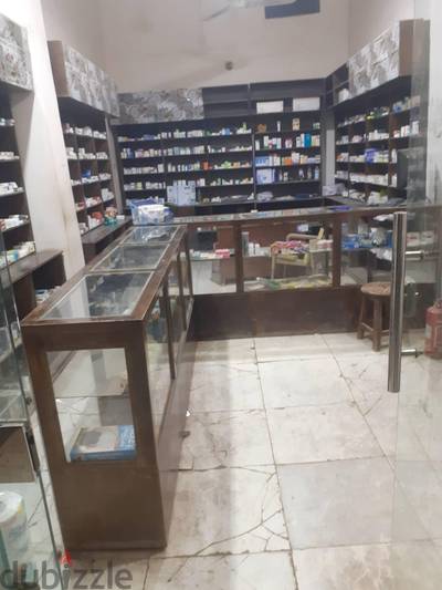 تجهيز صيدليه كامل أثاث خشبى بالرفوف وواجهه سيكوريت بسعر لقطه