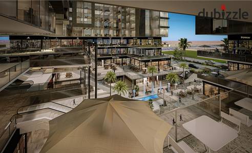 Commercial store for sale in installments 20m at Ninth Hub Mall October in front of the monorail with a 10% down payment and 10 years installments