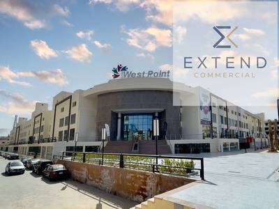 A distinctive facade in the heart of 6th of October on the central axis, a shop for rent inside a commercial mall suitable for all activities with high traffic density