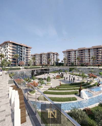 Ground-floor apartment with a garden for sale in the Midtown Condo compound (R7, New Administrative Capital)—10 minutes from New Cairo—with a 10% dp