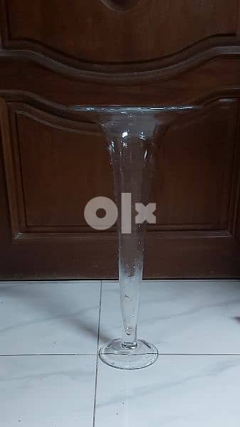 a tall glass vase