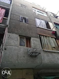 عقار ٤ أدوار و سطح مبنى للبيع فى وراق العرب شارع القومية 0