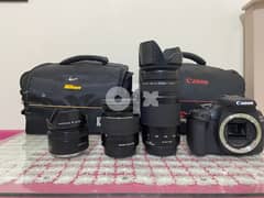 canon 2000D with 3 lenses ( lens 50mml )(75-300)(18-50) and two bags 0