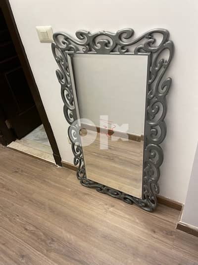 New mirror measuring 70 * 120 in a decorative wooden frame.
