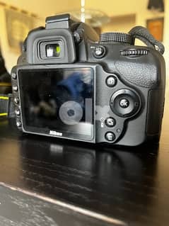 Nikon D3200 with 2 lenses, original charger and a bag.