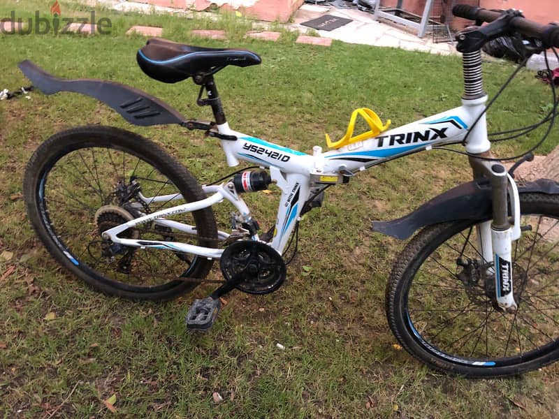 Trinx folding mountain discount bike