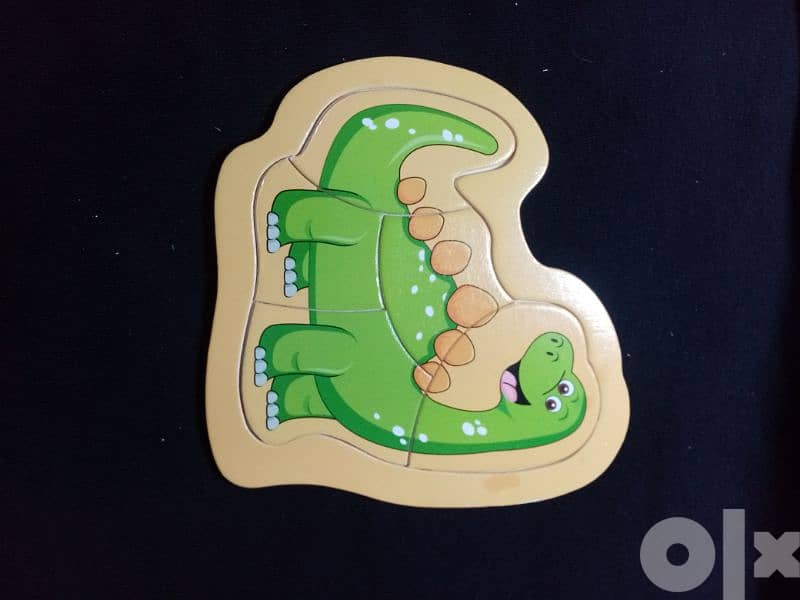 Wooden Dinosaur Puzzles   بازل للأطفال 1