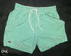 Lacoste sports swimming shorts small size. 0