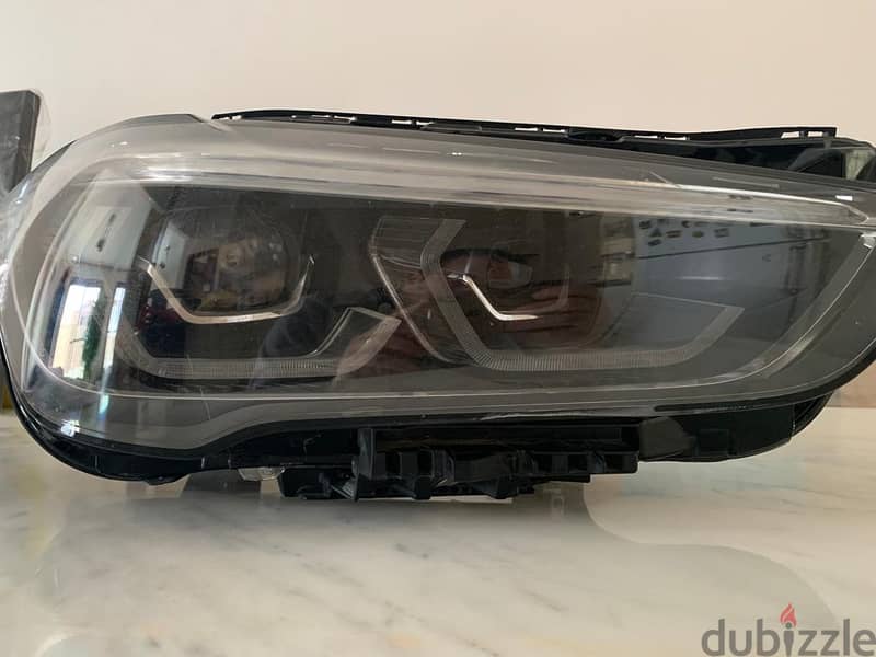 BMW X1 head light 2021 (barely used)     فانوس بي ام دابليو X1 2021 1