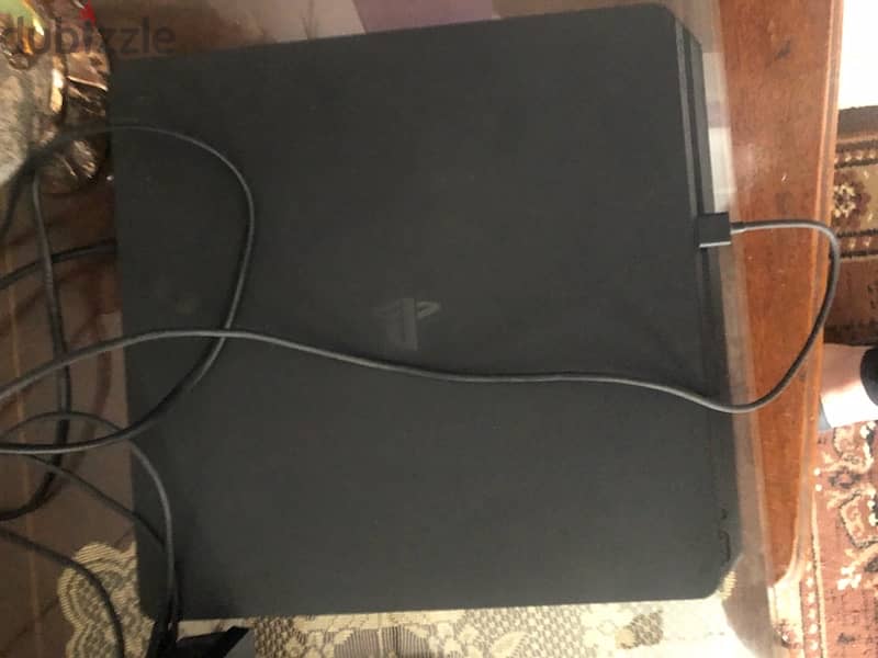 playstation 4 slim 1 tera with 2 controllers , condition :  excellent 5