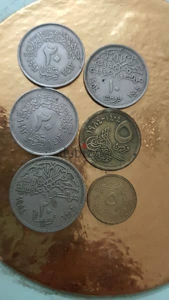عملة قديمة ٢ دولار كندي الملكة إليزابيث وعملات منوعه مصريه وسعوديه 2