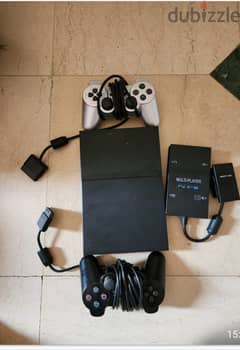 PlayStation 2 with 2 controllers, Multiplayer adapter and 5games