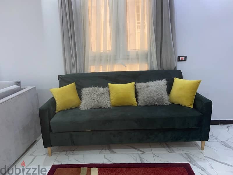 dark green sofa 1