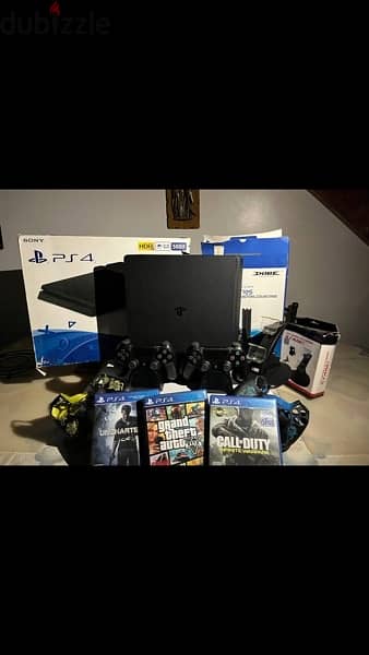 ps4 + 2 controllers + 3 games + 2 stands 0