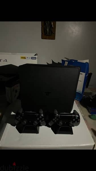 ps4 + 2 controllers + 3 games + 2 stands 6