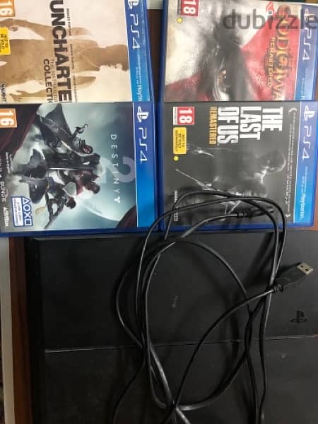 PS4 Fat 1 TB Used + Cables + 2 controllers + 6 games 4