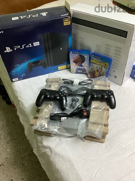Brand NEW PS4 Pro 1 TB & 2 original controllers and all accessories 2