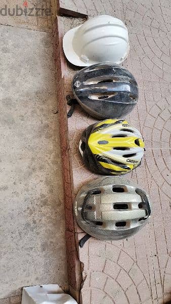 FOUR SAFETY HELMETS FOR BIKING GOOD CONDITION