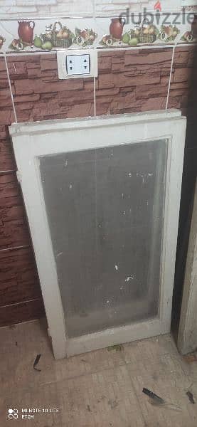 شباكين خشب و باب بلكونه (٧٥٠*٢ + ١٠٠٠)