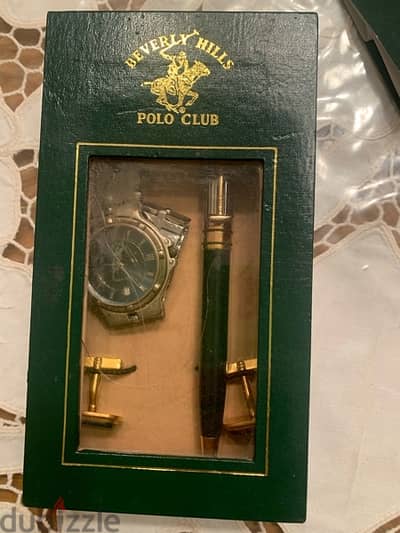 A Polo clup box of two items whatch and a pen