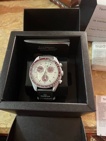 Brand new original Omega swatch mission to Pluto from UAE 1