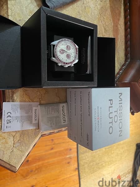 Brand new original Omega swatch mission to Pluto from UAE 2