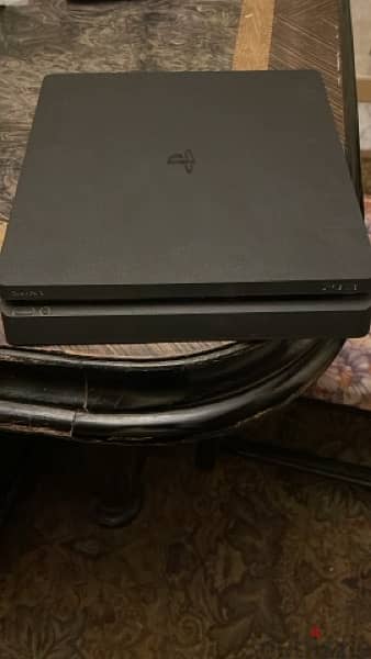 PlayStation 4 slim with 3 games and 2 joysticks 1