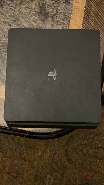 PlayStation 4 slim with 3 games and 2 joysticks 2