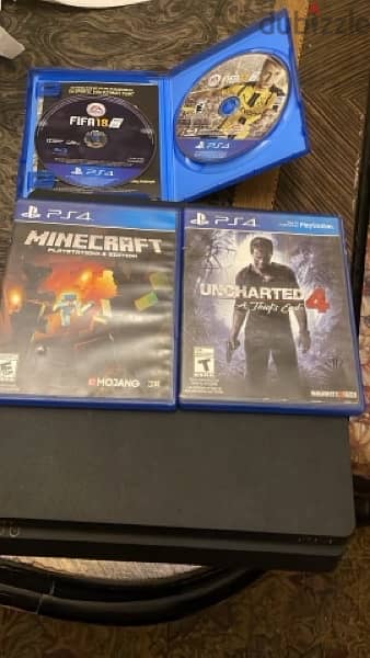 PlayStation 4 slim with 3 games and 2 joysticks 3