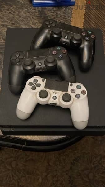 PlayStation 4 slim with 3 games and 2 joysticks 4