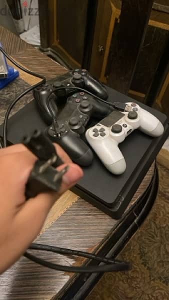 PlayStation 4 slim with 3 games and 2 joysticks 6