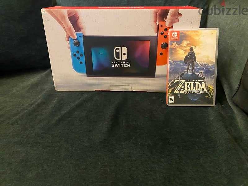 Nintendo switch with carry case and legend of zelda game 1