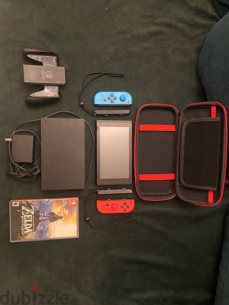 Nintendo switch with carry case and legend of zelda game 2