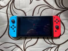 Nintendo Switch Console with Neon Blue and Red Joy‑Con 0