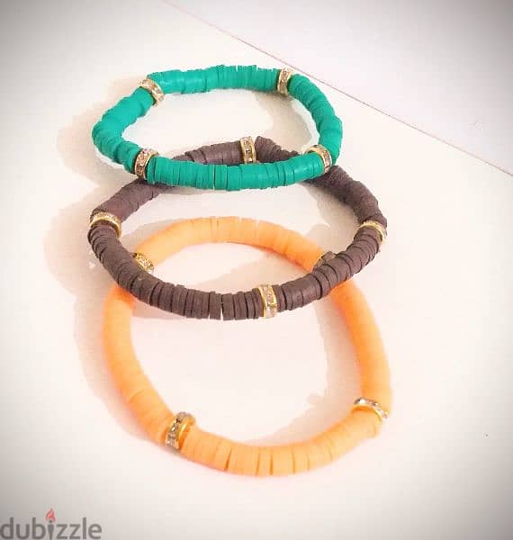 Bracelets  أساور جامايكا بفواصل دهبي أخضر، برتقالي وبني. 9