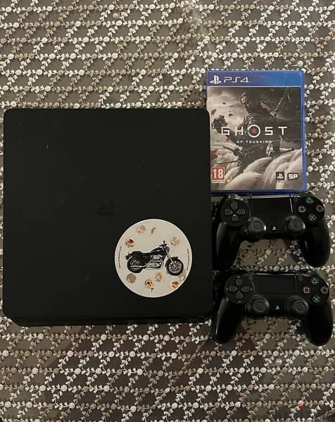 ps4 slim 1tb with 2 orginal  controllers and ghosts of tsushima game 1