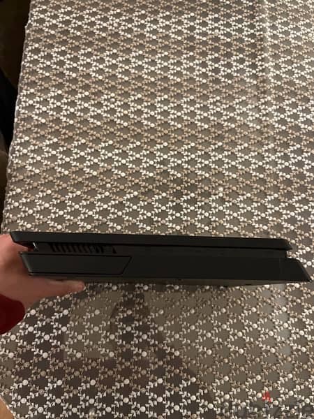 ps4 slim 1tb with 2 orginal  controllers and ghosts of tsushima game 4