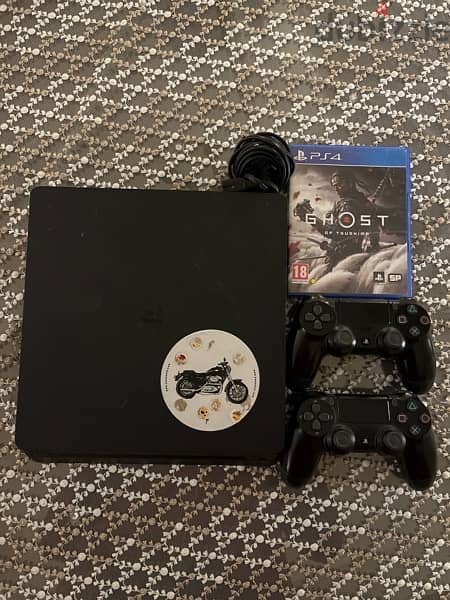 ps4 slim 1tb with 2 orginal  controllers and ghosts of tsushima game 5