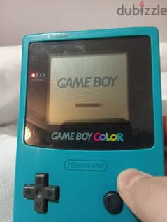 used game boy colour with the adaptor and 2 games