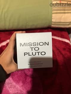 Omega swatch pluto with its box with warrantly