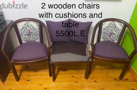 Wooden two chairs with cushions and table